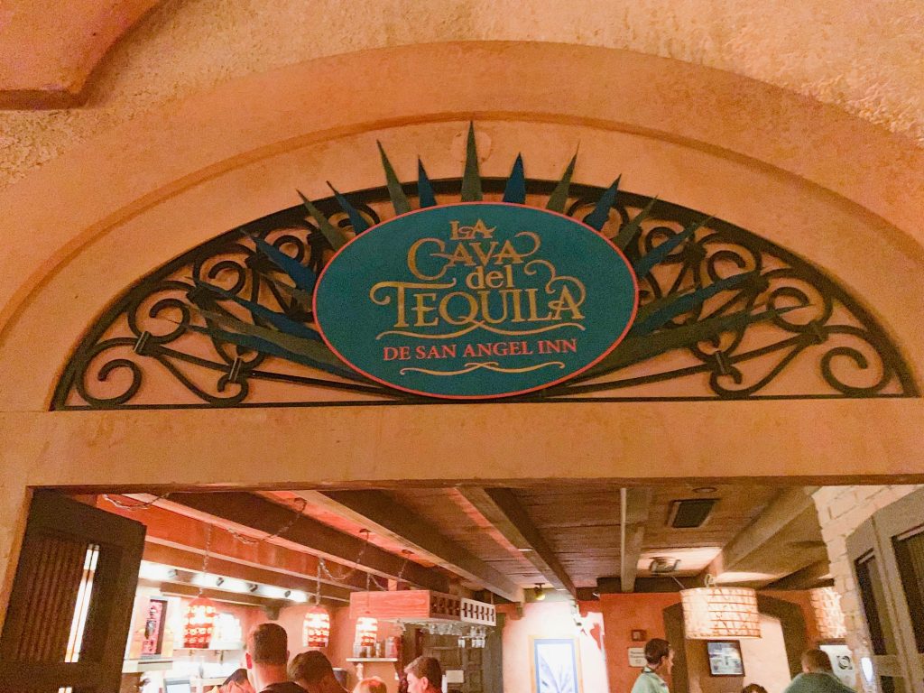 blue sign for la cava de tequila in archway best things to do in EPCOT