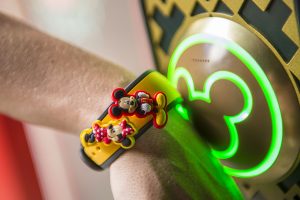 yellow disney magic band with mickey and minnie charms