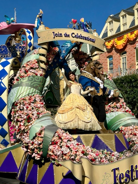 belle and beast on floral parade float best things to do in Magic Kingdom
