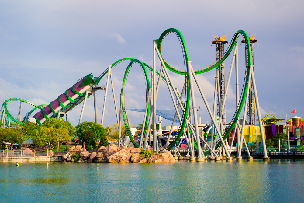 A green and purple coaster featuring a huge launch tunnel and tons of loops is known as the Hulk at Islands of Adventure. 