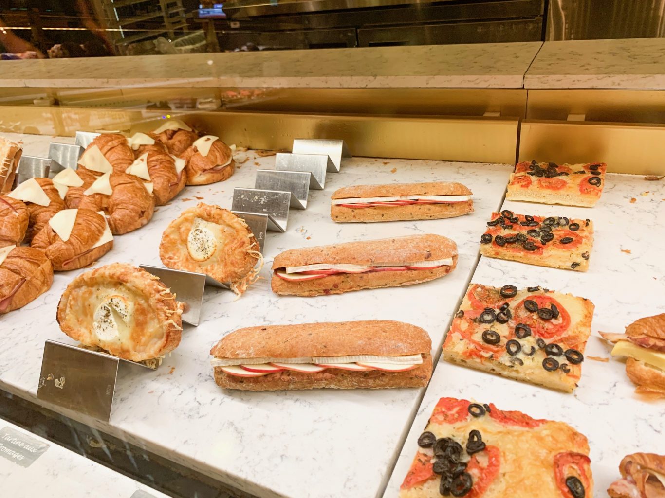 sandwiches and baked goods in case hidden gems at Disney