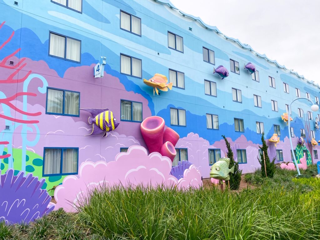 fish and sea creatures on blue hotel building at art of animation, best Disney value resorts