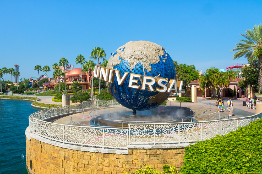 universal studios globe on a sunny day with palm trees