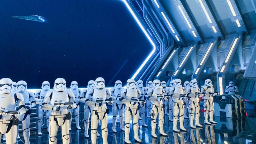 Storm troopers gather in lines with their guns poised as a part of the rise of the resistance: this ride is beyond immersive for Star Wars fans! 