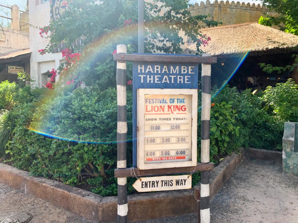 The sign of the Harambe Theatre lists the show times for the Festival of the Lion King.