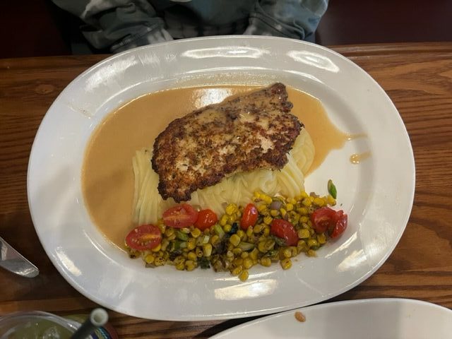 Of all the best restaurants at Universal Orlando, Finnigen's offers great food and plating with meals like this chicken and potatoes and corn! 