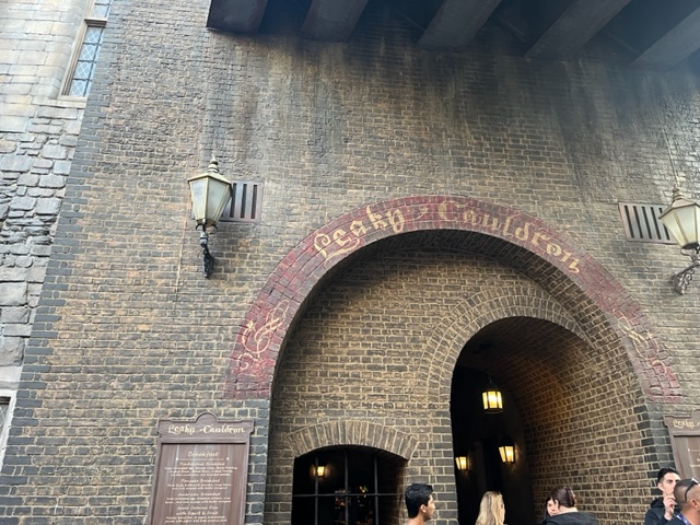 The arch above the Leaky Cauldron restaurant welcomes guests into the London setting of the Wizarding World.