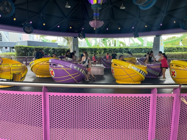 People load into the spinning teacups of StormForce's ride: I hope they packed motion sickness because some of these rides get intense. 