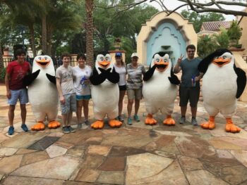 people standing at universal orlando with characters dressed up