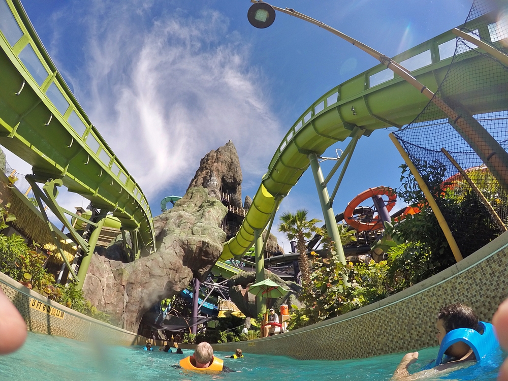 An upward angle shows the water coasters at Volcano bay from the perspective of a friend floating down the lazy river: waterproof phone cases are vital for any water ride, water park, and the rain! 