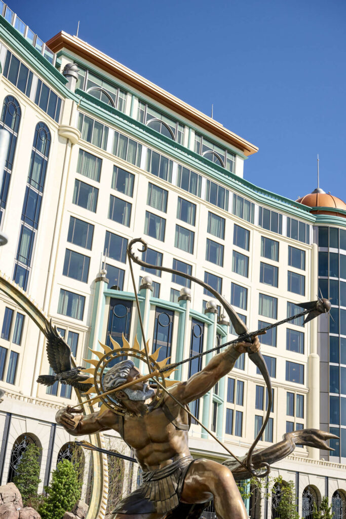 The front of the Helios hotel that enters Epic features a giant station of Helios pointing an arrow at the sun.