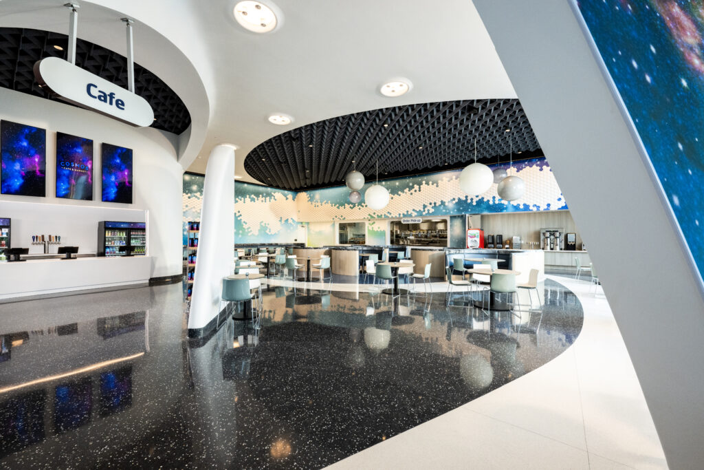 A cafe at Stella shows of galaxy vibes and open seating.