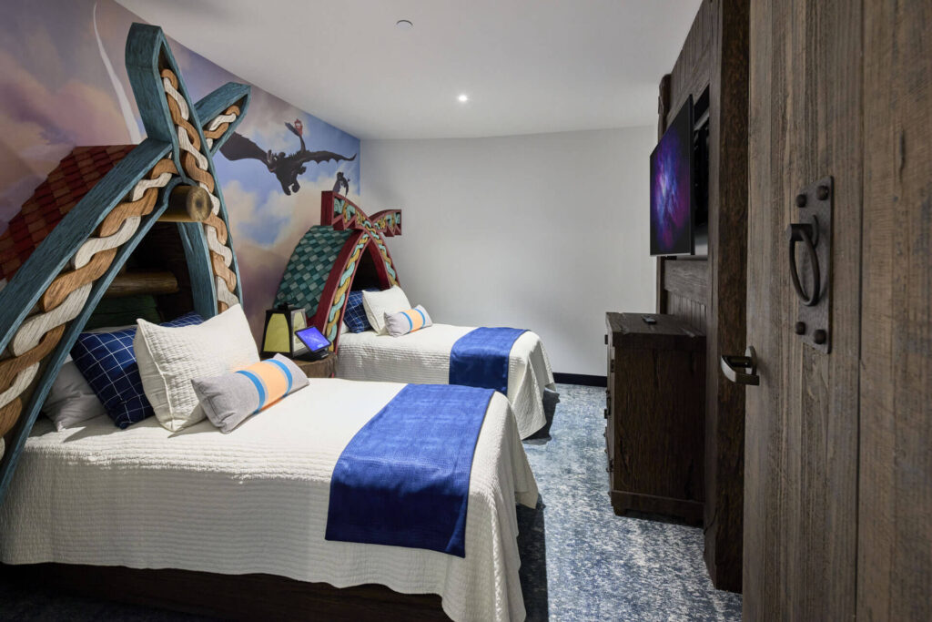 The kids suite in Helios is how to train your dragon themed with murals, and boat like beds!