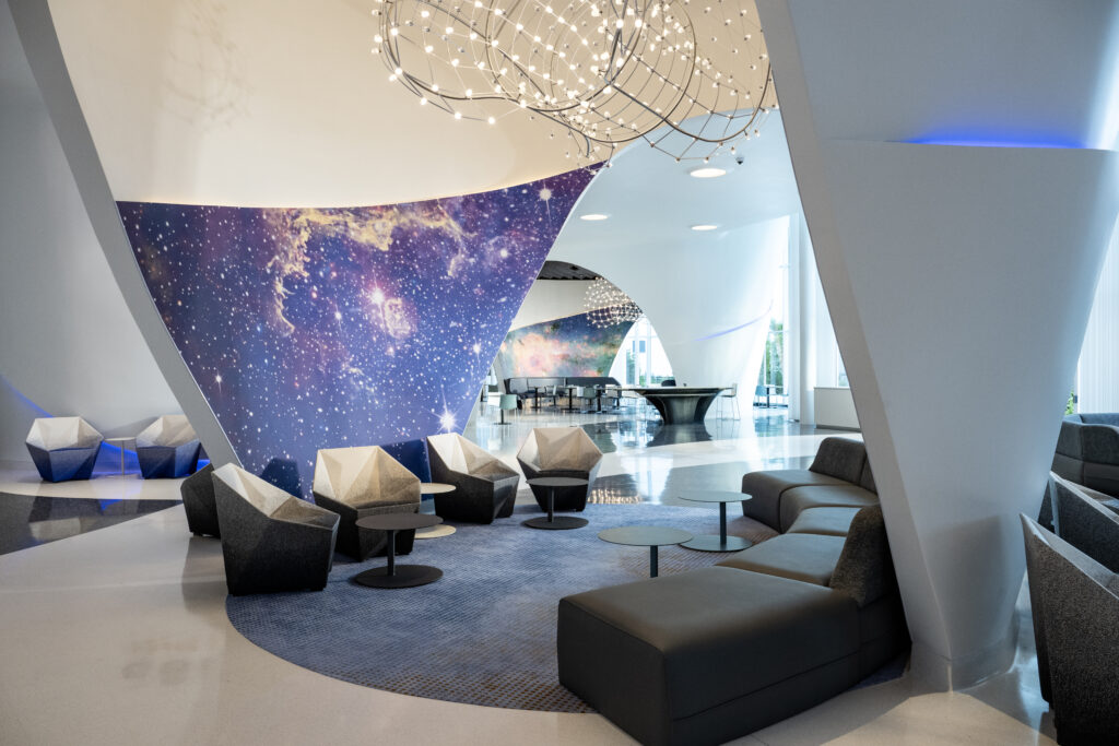 The extra sitting room in Stella features stars and clouds and geometric shapes for chairs to really sell the theme.