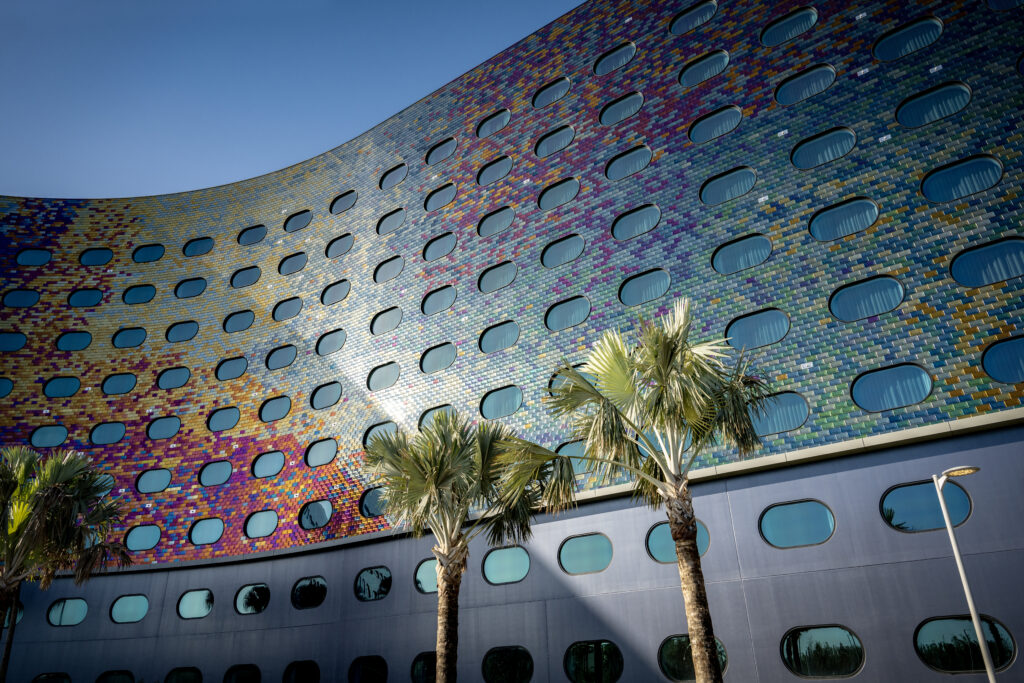 The exterior of Stella Nova glistens in the light with space like colors.