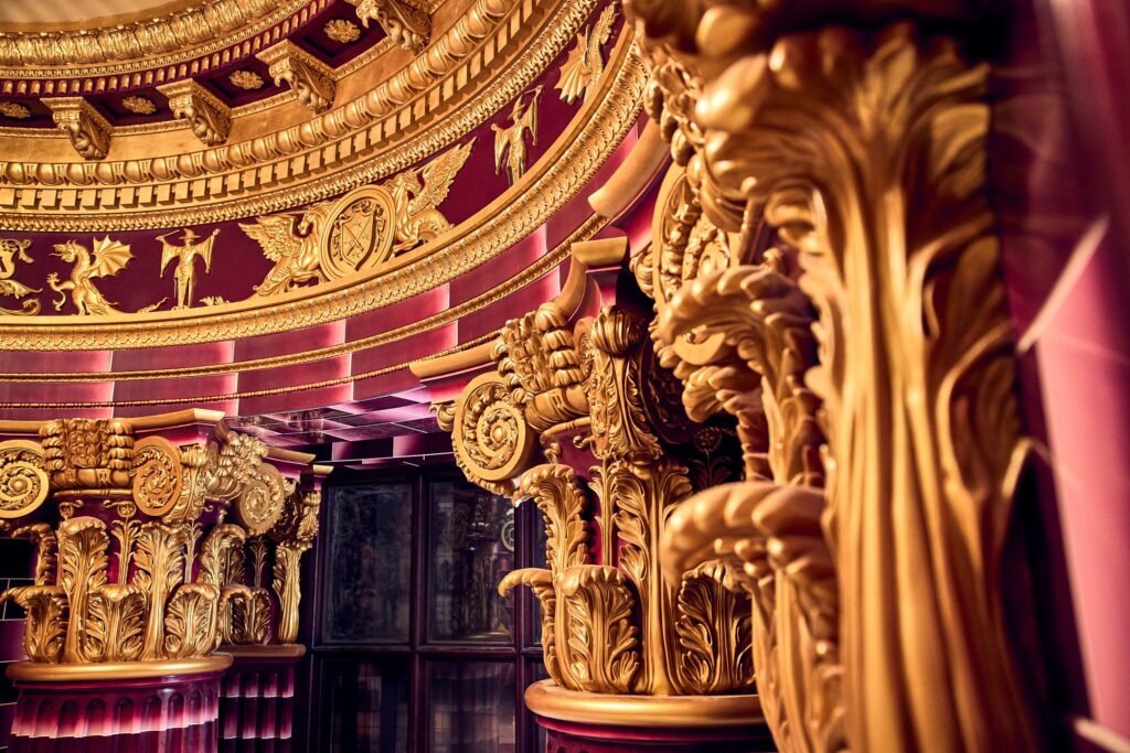A professional close up shows the intricate detail of Umbridge's office, all pink and gold.