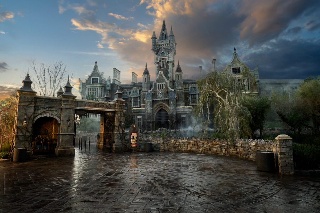 A dark picture of Frankensteins manner shows clouds and even some left over rain, setting the vibe, but also letting you know to bring rain prep gear when preparing your Epic Universe packing list.