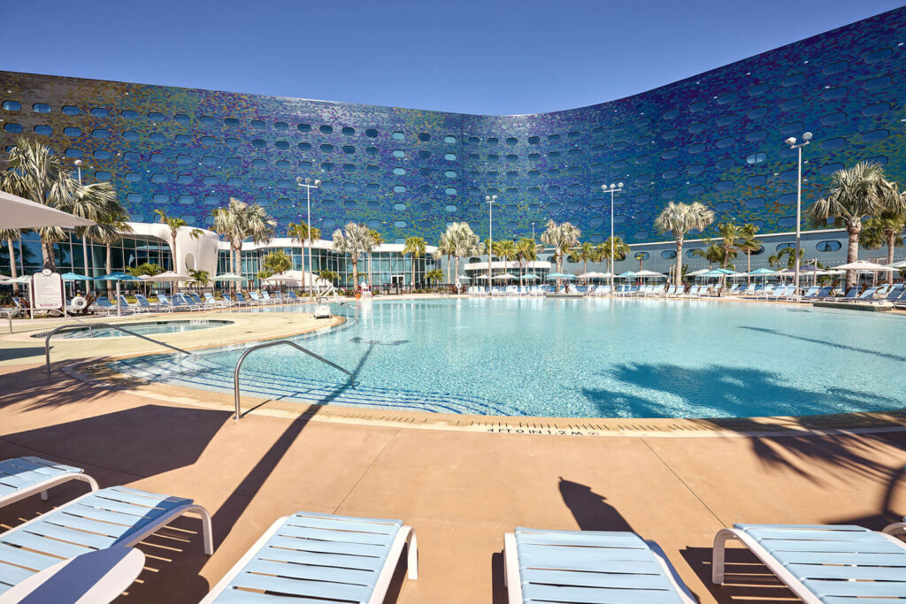 A pro shot shows the pool of one of the Luna resorts: the blue hues are prefect, and it's good to know to bring a suit if you are considering what to wear in your epic universe packing list!