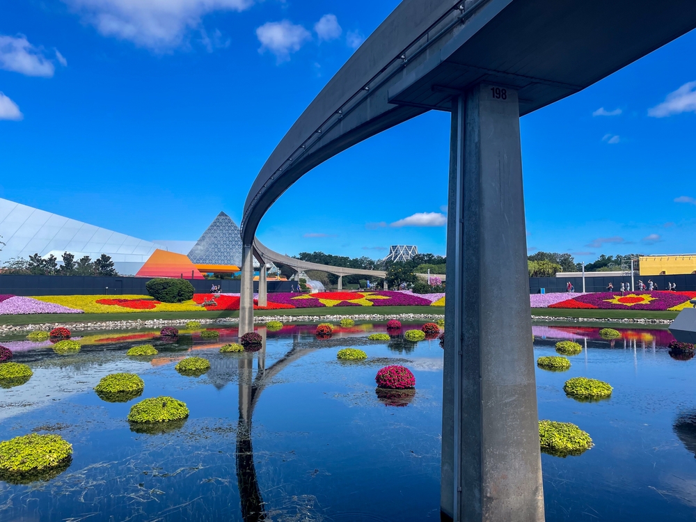 The monorail service arches over the pond and Epcot, with spurts of colorful flowers everywhere for the flower festival. 