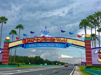 The Walt Disney World Sign welcomes guests with Mickey and Minnie on the sides: knowing Things People Forget When Packing for Disney World will help prepare for this magical trip!