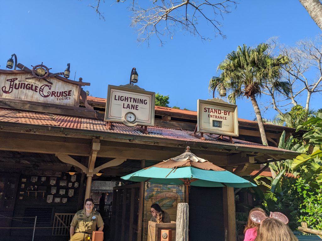 wooden entrance and sign with trees and umbrella outside jungle cruise 