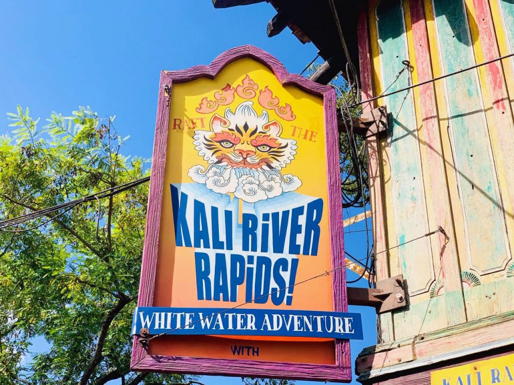 bright orange and blue wooden sign for kali river rapids disney rides not worth the wait